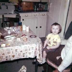 Me sitting on Grandpa's lap. (Yes, that's a cigarette butt)